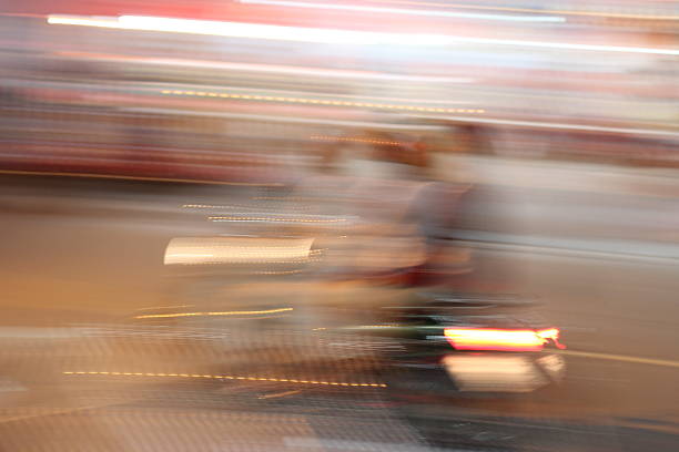 istock Street lights in speeding Motorcycle driver at night time, 545679766