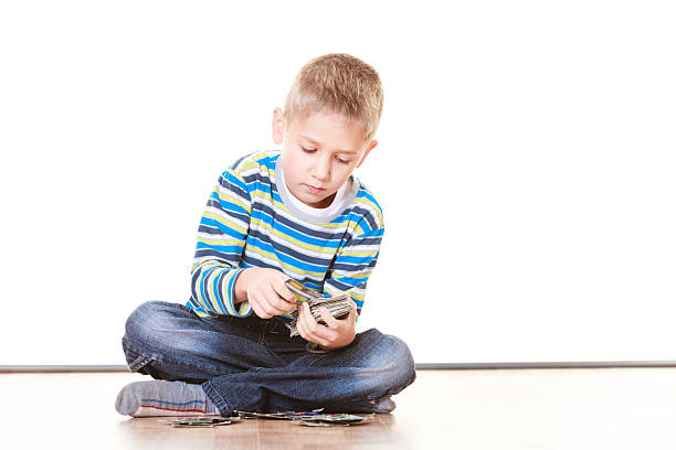 Little boys have fun and play cards.
