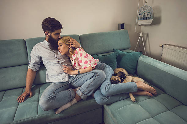 istock Affectionate couple relaxing together in the living room. 545773796