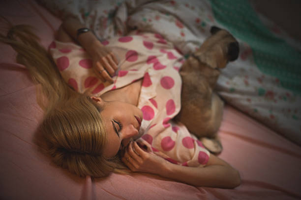 istock Young relaxed woman taking a nap in her bed. 545774952