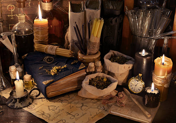 istock Mystic still life with healing herbs, candles and magic books 545776084