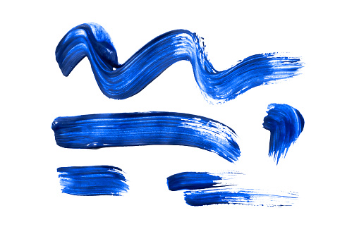 Group of blue  paint brushstrokes isolated over white