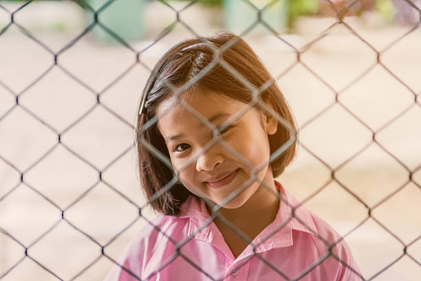 istock The girls smiled through the mesh 545779066