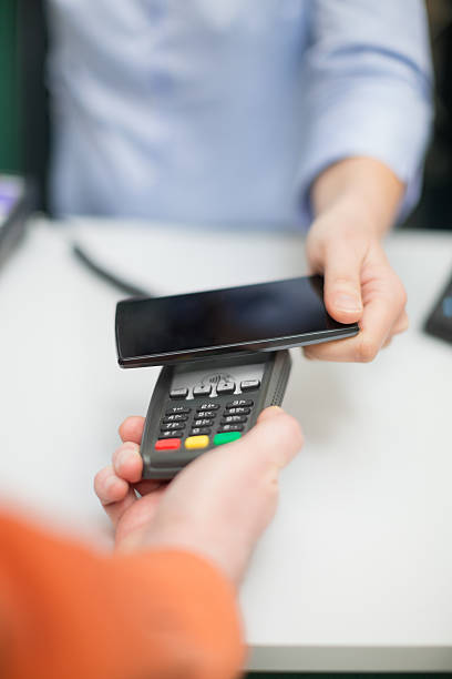 istock Contactless payment with smart phone 545780008