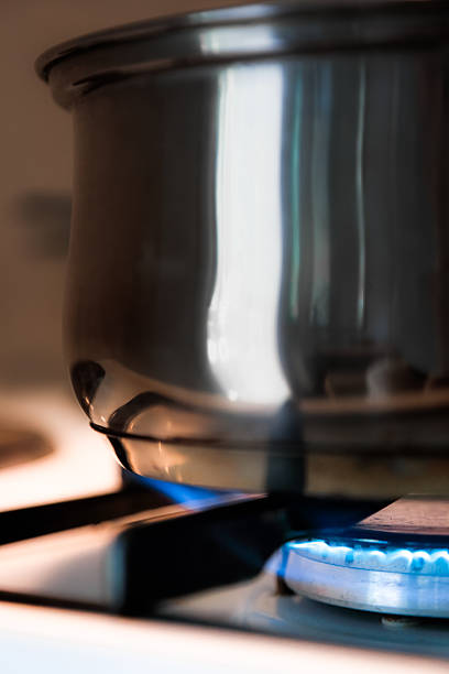 istock Blue flame on gas stove burnner under kitchen pot 545780248