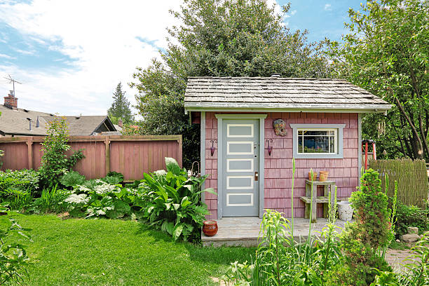 istock Home garden on backyard with small red barn shed 545780846