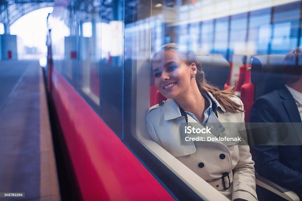 Happy woman Smiling woman in a train Train - Vehicle Stock Photo