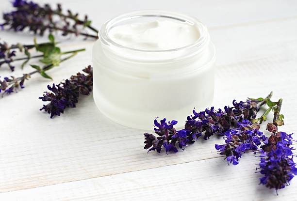 istock White herbal salve and Salvia flower 545783082