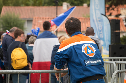 Saint Gilles Croix de Vie, France - July 10, 2016: In the fan zone of the city, the team of French civil protection chief monitors spectators came to watch the final match of Euro 2016, France - Portugal