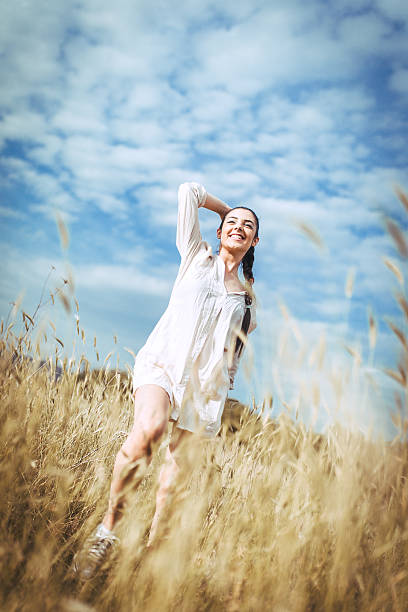 istock young woman in the field 545784066