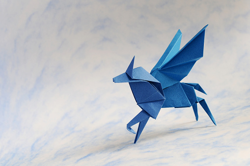 Business Change For Success. New innovation and Evolution through Transformation Concept Creative Conceptual Idea. Crumpled Paper Transforms to a Flying Origami Bird.
