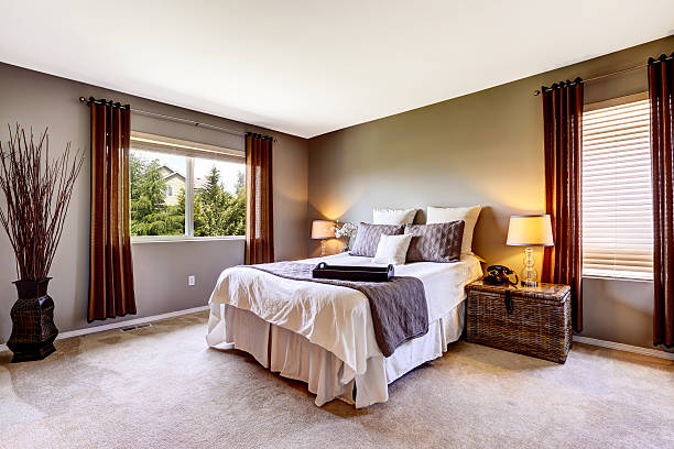 istock Bedroom interior with carpet floor and big bed 545785790