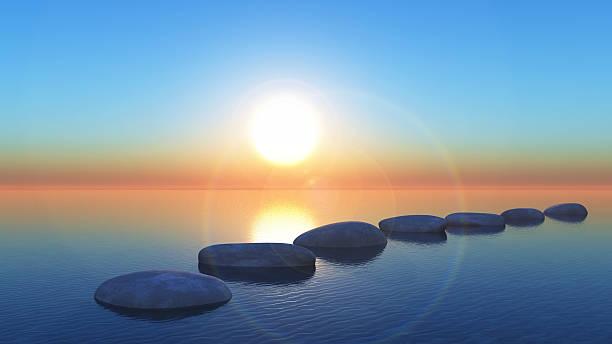 istock 3D stepping stones in the ocean at sunset 545786906