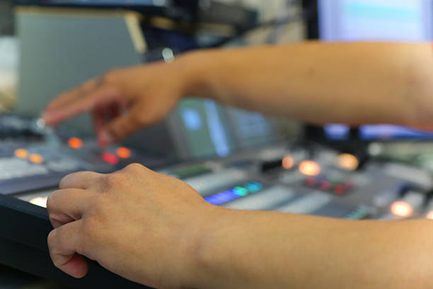 istock TV engineer working editing  with video and audio mixer 545787310
