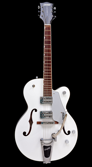 Cape Town, South Africa - July 6, 2016: A Gretsch G5120 Electromatic archtop electric guitar with a Bigsby tremolo system, noted for its twanginess. Gretsch, an American family-owned business, was founded in 1883. It became a famous brand during the early rock 'n roll era of the mid-20th-century, with Bo Diddley and Chuck Berry prominent players. Country guitarists such as Chet Atkins, and pop artists such as George Harrison of the Beatles, also helped promote the brand. Rockabilly revivalists such as Brian Setzer and the Stray Cats have kept Gretsches familiar to modern audiences.