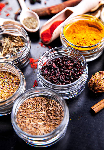 istock Spices on black background in special jars. Food 545788294