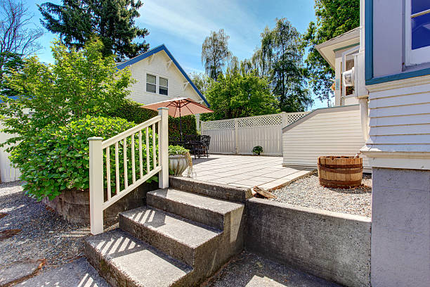 istock Concrete floor cozy patio area with iron table set 545788758