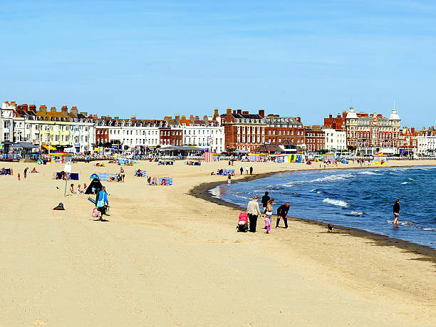 Weymouth, Dorset. Weymouth, Dorset, UK. September 11, 2009. Holidaymakers enjoying the sunshine on the beach and seafront in September at Weymouth. weymouth dorset stock pictures, royalty-free photos & images