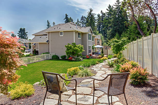 istock House with backyard patio and landscape design 545790358