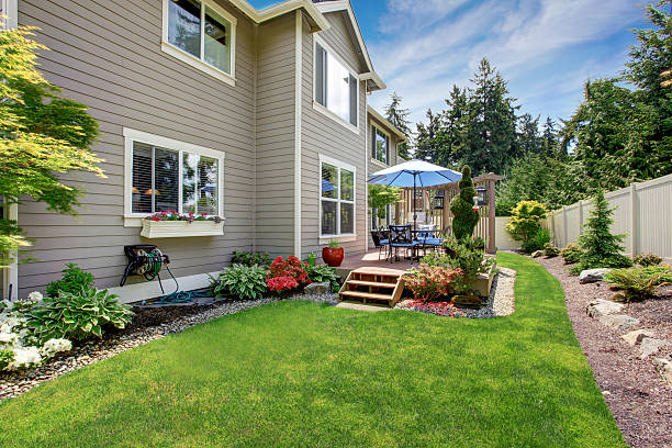 istock House with backyard patio and landscape design 545790630
