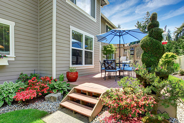 istock House with backyard patio and landscape design 545790730