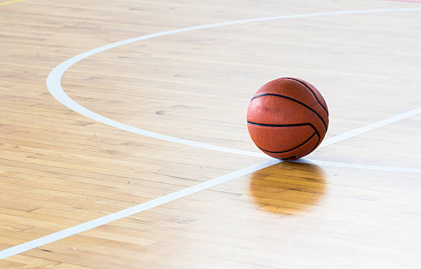 istock Basketball ball over floor in the gym 545790804