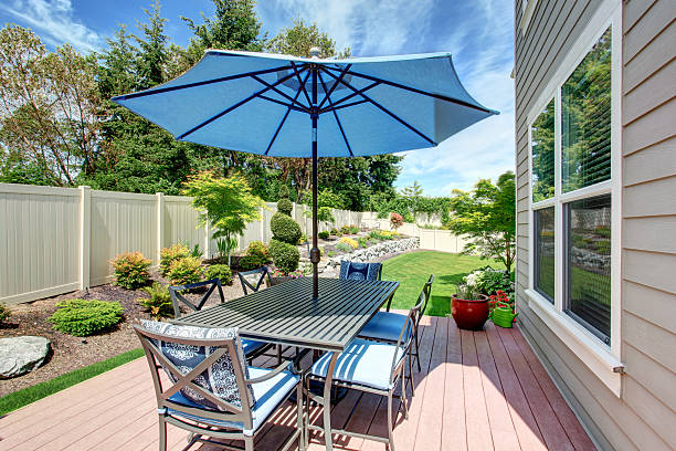 istock House with backyard patio and landscape design 545790914