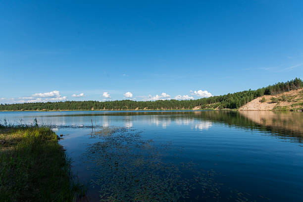 istock Blue lake and blue sky with clouds. Summer landscape. 545791020