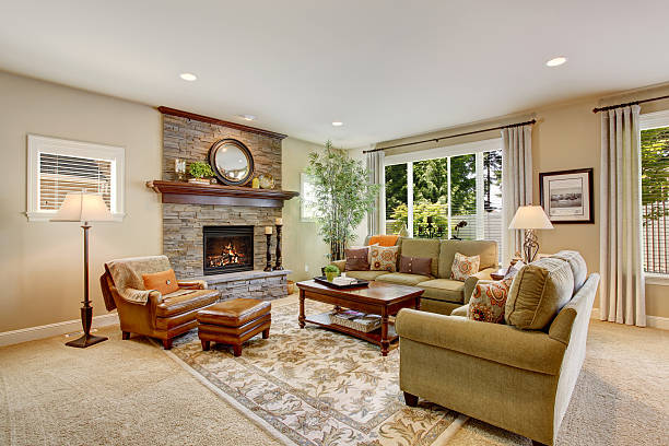 istock Spacious living room with fireplace, carpet floor and rug 545791546