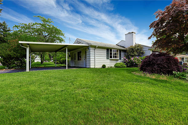 istock American rambler exterior. Grass filled yard with shrubs. 545794688