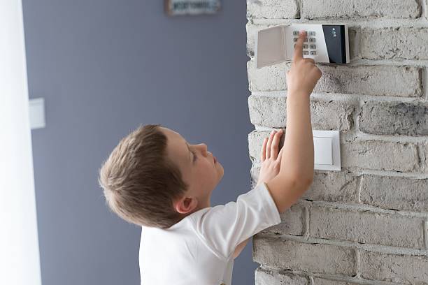 Alarm system keypad mounted on a wall