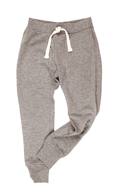 istock Grey sports trousers on white background 545795654