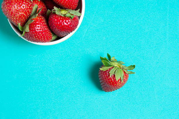 istock Fresh strawberry and juice on wood table. flat lay. 545796076