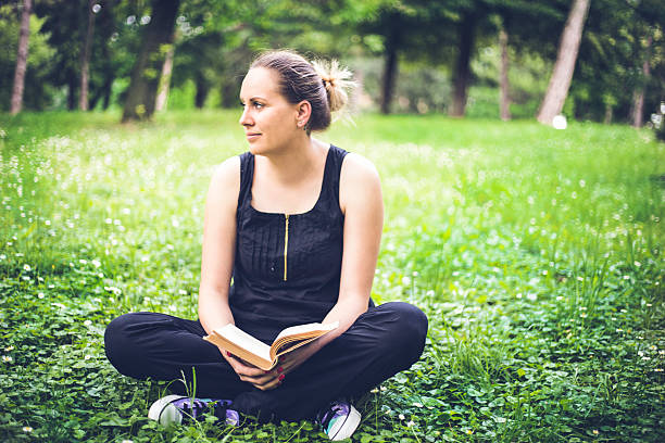 istock Beautiful Girl with a book 545796150