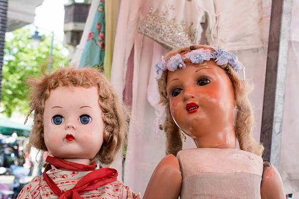 istock vintage dolls together on flea market 545796736