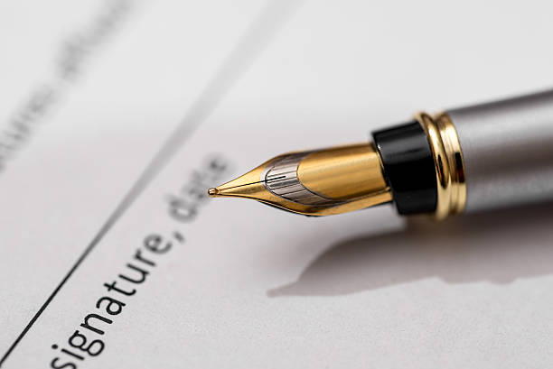 istock contract for purchase of car with pen 545797686