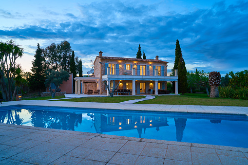 country estate with swimming pool and huge garden in the evening