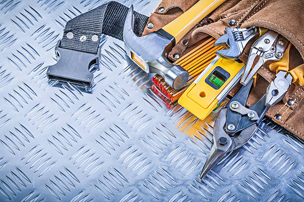 istock Collection of construction tooling in tool belt on corrugated me 545799104