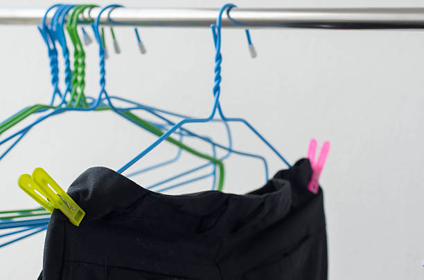 istock black trousers and hanger drying on a clothes line.. 545799166