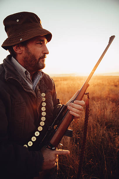 istock Caucasian hunter looking at his prey on grassland 545799196