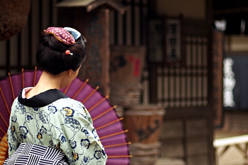 Japanese woman in the Edo period holding an umbrella