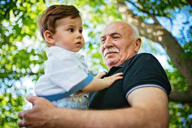 istock Grandfather holding his grandson 545800610