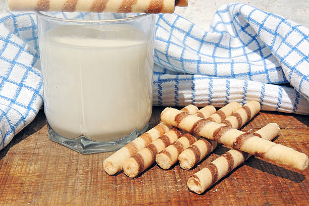 istock Milk and waffle rolls on wooden Board 545802010