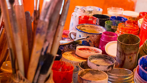 istock Art brushes colors in painting studio 545802098