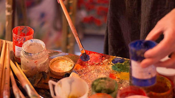 istock Art brushes colors in painting studio 545803726