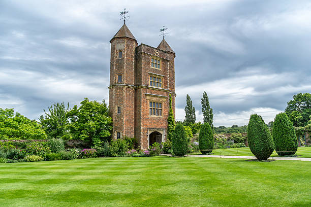 Sissinghurst, England - July 7, 2016: Sissinghurst's garden was created in the 1930s by Vita Sackville West, poet and gardening writer, and her husband Harold Nicholson, author and diplomat. The garden itself is designed as a series of 'rooms', each with a different character of colour and/or theme, the walls being high clipped hedges and many pink brick walls