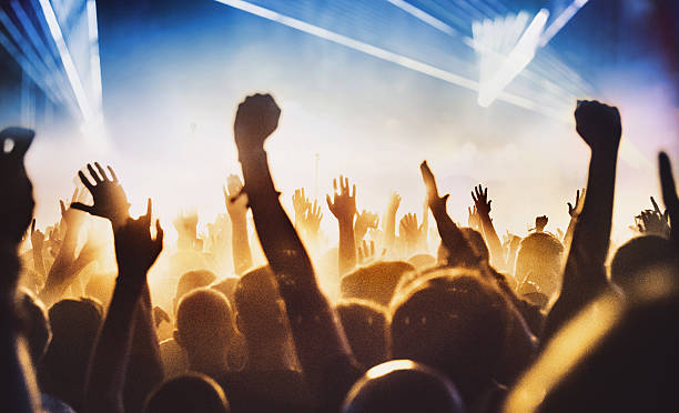 istock People at concert party. 545806894