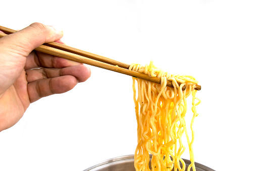 Food - noodles ramen grapples with chopsticks isolate on white background