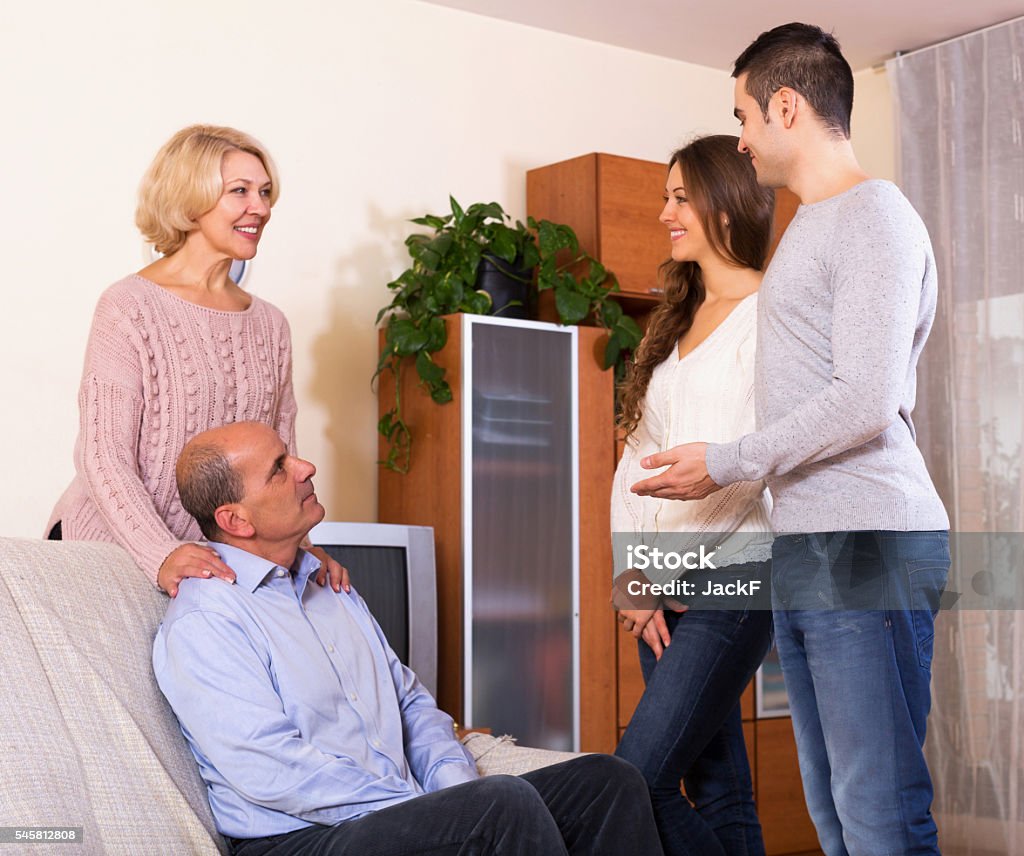 parents meeting girlfriend of their son at home today parents meeting girlfriend of their son at home Greeting Stock Photo