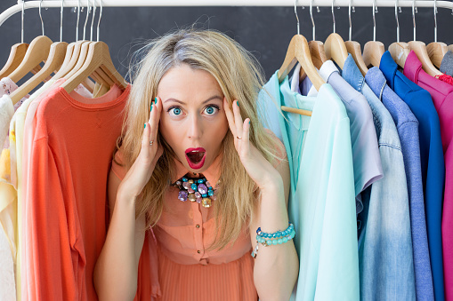 Stressed woman deciding what to wear